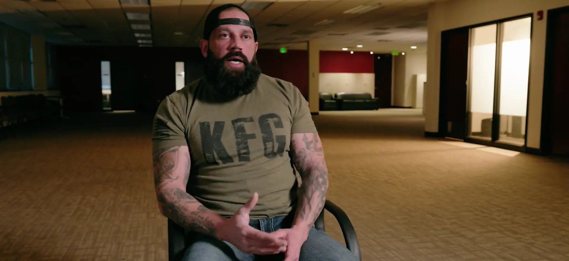 Jeff Marr speaking to camera during an interview in an empty building