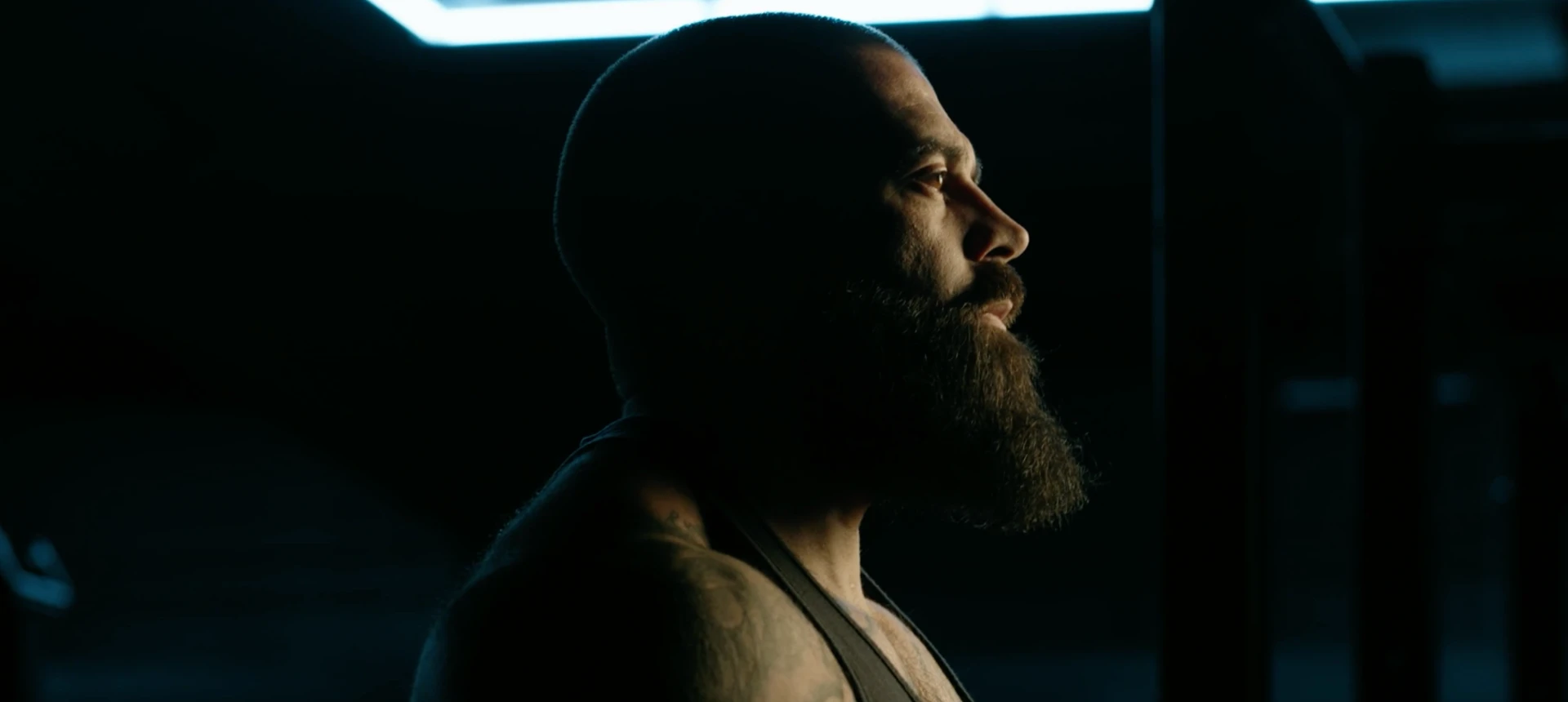 Profile of Jeff in a darkened gym