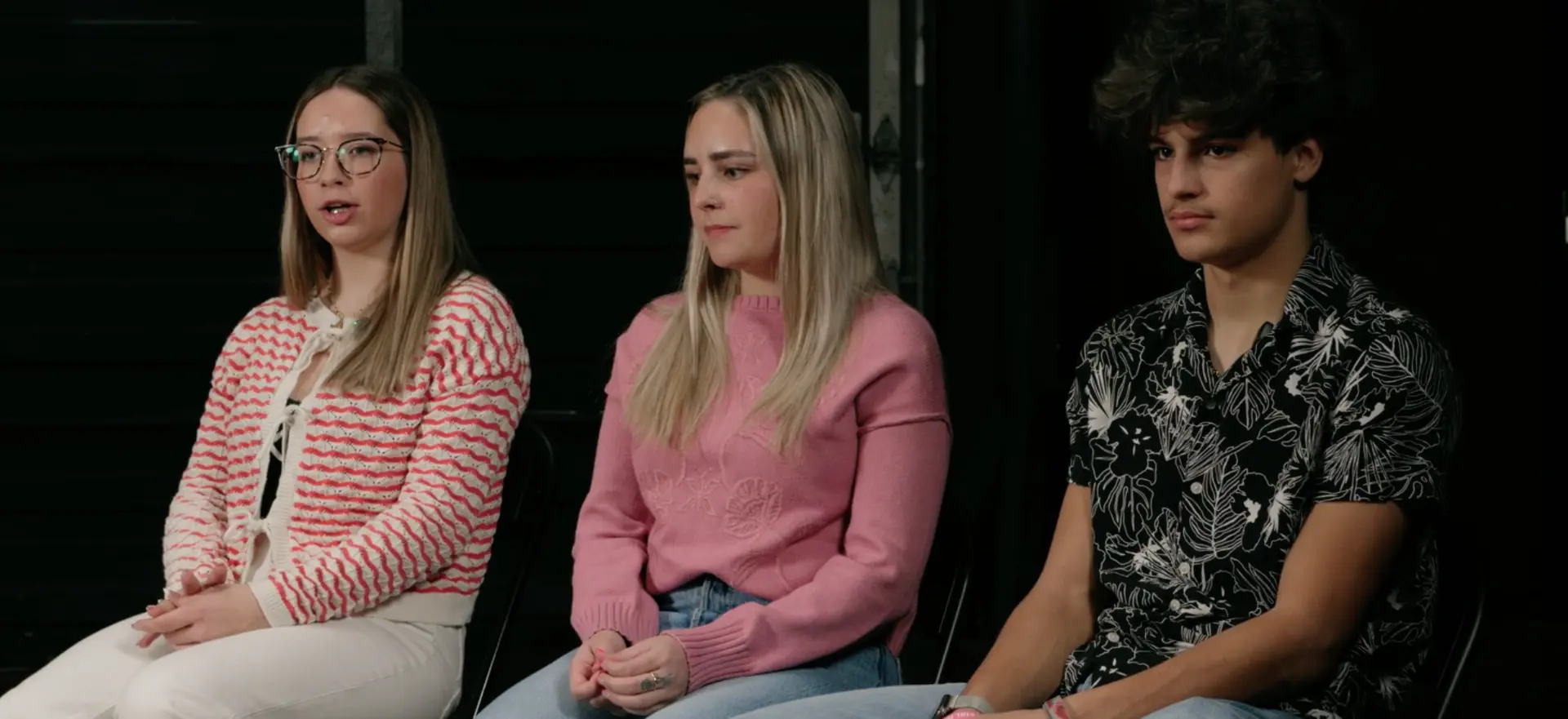 Jeff's three kids seated together during a candid interview